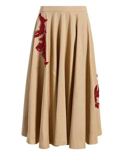 Beige skirt with red floral embroidery on a white background