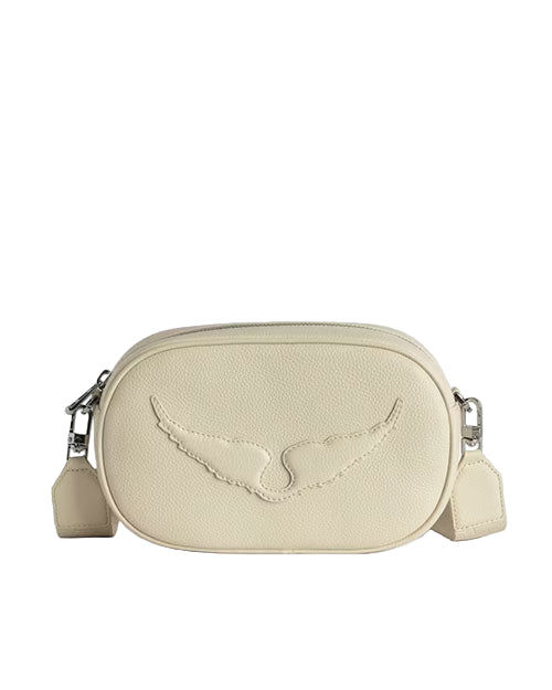 A beige leather handbag with an embossed wing design on the front, featuring a zipper closure and metal hardware attachments for the strap.