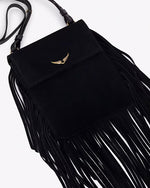 A close-up overhead view of a black handbag with one long strap and gold hardware, including tassels at the bottom and sides, and a gold wing design adorned at the top center.