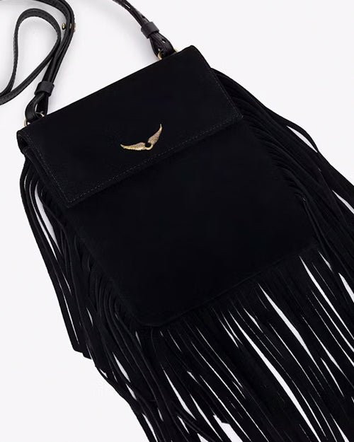 A close-up overhead view of a black handbag with one long strap and gold hardware, including tassels at the bottom and sides, and a gold wing design adorned at the top center.