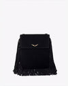 A close-up view of a black handbag with tassels at the bottom and sides, and a gold wing design adorned at the top center.