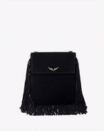 A close-up view of a black handbag with tassels at the bottom and sides, and a gold wing design adorned at the top center.