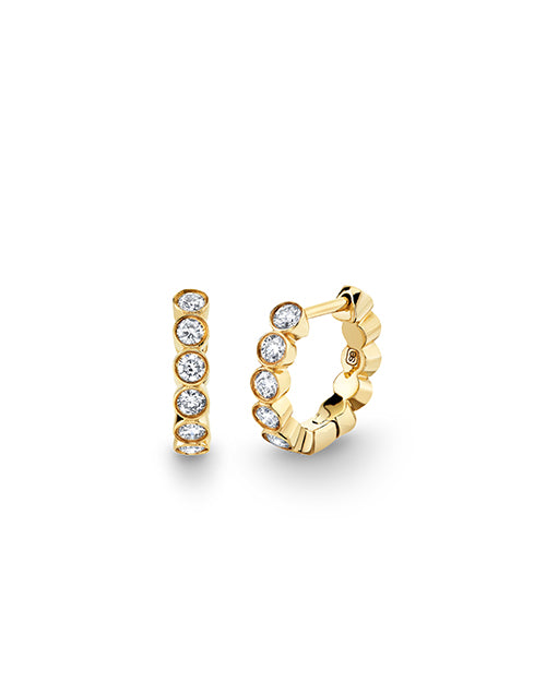 Diamond Bezel Huggie Earrings on a white background.
