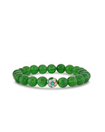 A green onyx beaded bracelet, at the center of the bracelet is a decorative element featuring gold detailing and small gemstones, with one larger stone at the center surrounded by smaller pave diamonds.