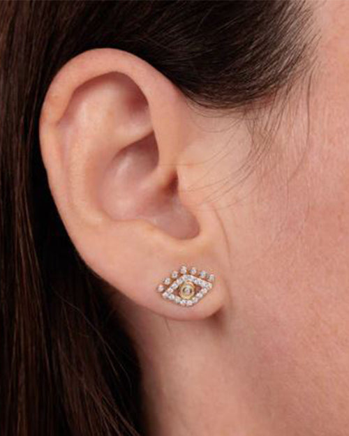 Close up on ear's model wearing Lash eye evil  earring.