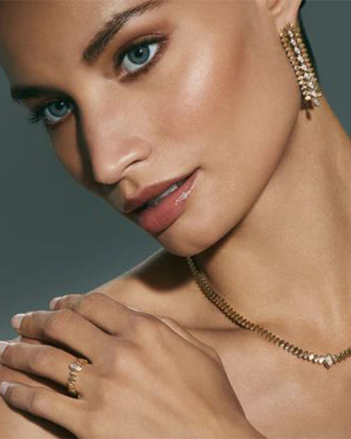 Marquise Eye collection: ring, necklace and earrings on a model.