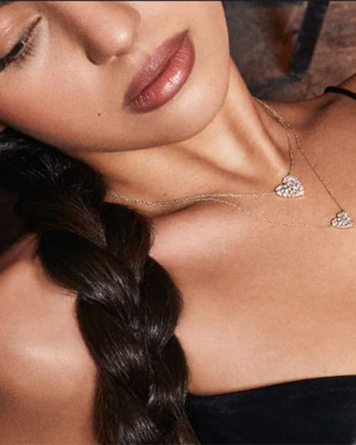 Model wearing Small Cocktail Heart Necklace and layered with the Large Heart Necklace to show difference of size.
