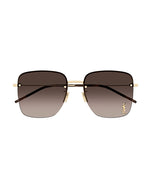 A front view of square frame sunglasses. The frame is gold-toned metal with tortoiseshell tips and brown llenses. On the bottom left lens is an embossed logo of ‘YSL'.