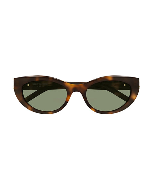 Front view of tortoiseshell sunglasses with a subtle cat-eye shape, and green lenses.