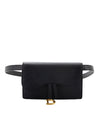  A black clutch purse with a curved flap closure, and a gold-colored clasp, accompanied by a matching black belt with a gold buckle. 