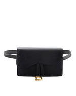  A black clutch purse with a curved flap closure, and a gold-colored clasp, accompanied by a matching black belt with a gold buckle. 