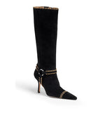 Black knee-high boot with a pointed toe, slim high heel, and contrast stitching along the top, ankle strap, and toe, featuring a small buckle detail.