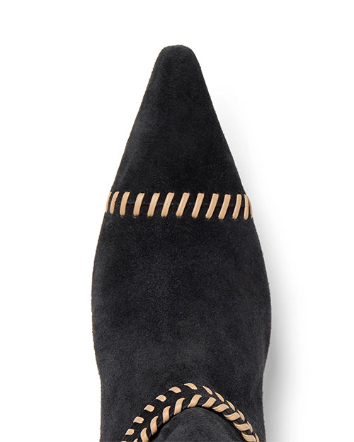 Black pointed-toe boot with brown stitching on a white background