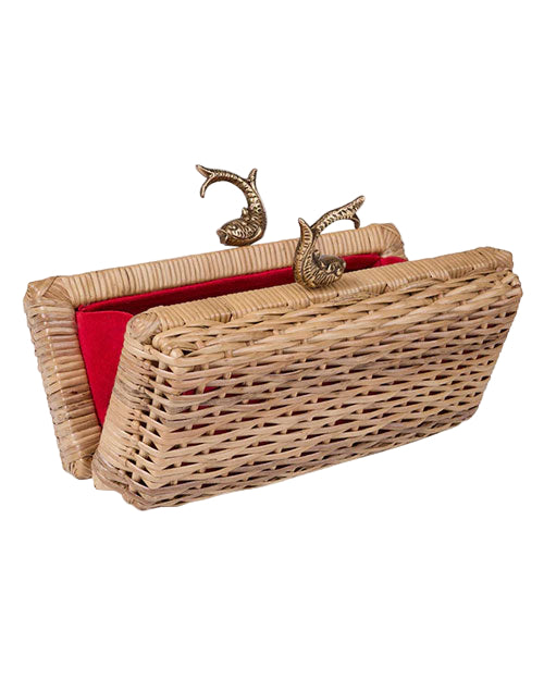 Woven wicker handbag with a red interior lining and two ornate metal clasps shaped like fish.