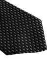 A close-up of a necktie with a black and gray geometric pattern, featuring small, tightly arranged hexagons. 