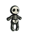 Plush toy resembling a skeleton with a black body and white skeletal features, including large eye sockets, ribs, and bones on the limbs. The face is white with black eyes and a small smile.