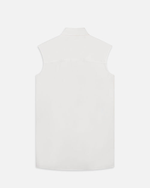 The backside of a sleeveless white shirt with a collar. 
