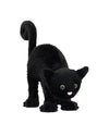 Black plush toy cat with green eyes and a pink nose, posed playfully with an arched back and curled tail.
