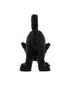 Rear view of a black plush cat with fluffy fur and raised tail, standing on all four legs.