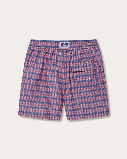 A back view of pair of shorts with a repeating geometric pattern in shades of blue, pink, and white. The shorts feature a elastic waistband. The shorts have a pocket with a flap on the right side.