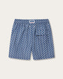 A back view of a pair of blue swim shorts with a drawstring at the waist. The shorts feature an all-over print consisting of small white and light blue motifs and back pocket.