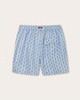 Back view of a pair of light blue shorts with a pattern of blue starfish and a pocket on the right side.