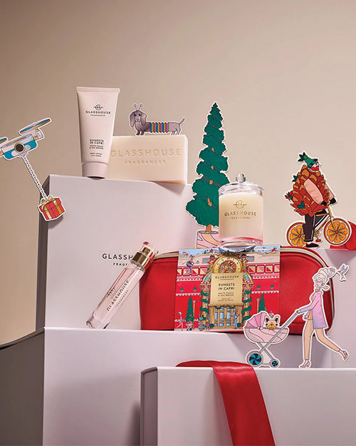 Collection of Glasshouse products including soap, lotion, and decorative items on a neutral background