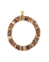 Circular bracelet made of brown, irregularly shaped beads, accented with gold-colored spacers embedded with clear stones. A round gold charm with an intricate design is positioned at the top.