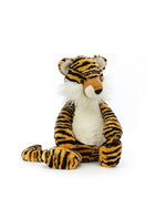 A plush toy tiger with prominent black stripes on an orange and white body. The toy has a friendly expression, and it features detailed facial characteristics including whiskers, a small black nose, and eyes.