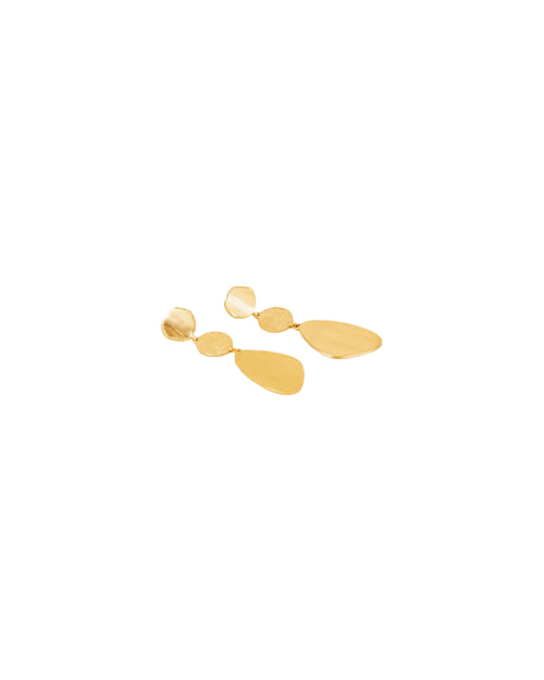 A pair of gold drop earrings with three connected segments: a small, irregularly shaped top piece, a round middle piece, and a large teardrop-shaped bottom piece. The image is taken from a slightly angled top-down perspective, highlighting the shape and texture of each segment.