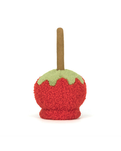 Back view of a Plush toy designed to look like a candy apple, featuring a red textured body, green caramel-like detailing at the top, and a brown stick protruding from the top, resembling a traditional candy apple.