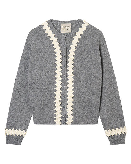 Grey cardigan with white zigzag patterns along the front edges and cuffs, featuring buttons down the center and a neck label reading 'Jumper 1 2 3 4'