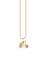 A gold necklace with a pendant in the shape of a classic scooter on a plain white background. The scooter pendant is detailed, featuring wheels, a seat, and handlebars. The chain is thin and delicate, suggesting the jewelry piece is elegant and possibly intended for fashion purposes.