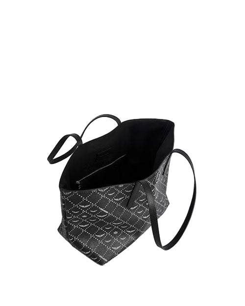 Black and white patterned handbag with a single strap. The top portion is solid black, while the bottom features a white geometric design on a black background. The strap is attached to the side.