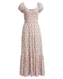 Light pink floral maxi dress with short puff sleeves, smocked bodice, wrap-style V-neckline, and tiered ruffle skirt.
