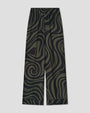 Dark olive and black wide-leg pants with an abstract swirling pattern and an elastic waistband.
