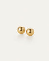 Pair of polished gold ball stud earrings with a smooth, reflective finish, displayed on a light background.
