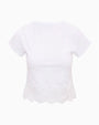 White cropped t-shirt with a scalloped lace hem. 