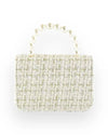 Back view of a small handbag with a light beige tweed-like textured fabric and a short handle made of pearl beads.