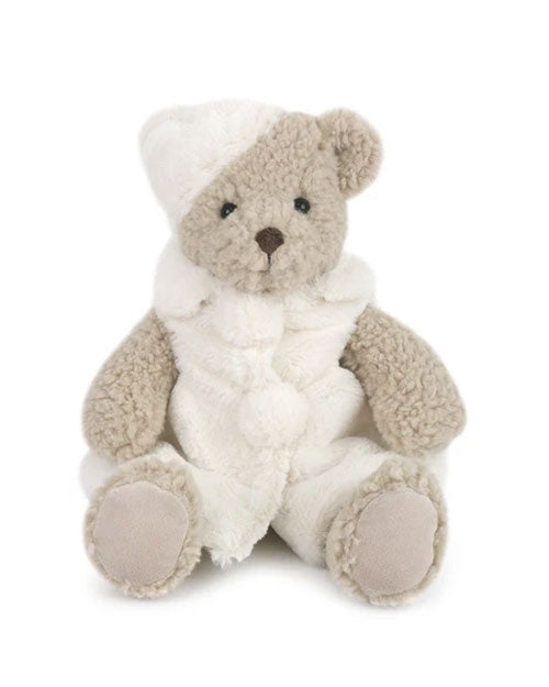  A plush teddy bear dressed in a cozy winter outfit, featuring a soft white hat and matching white clothing with fluffy pom-pom accents. The bear has light beige fur, a round brown nose, and fabric paw pads, creating a warm and festive appearance.