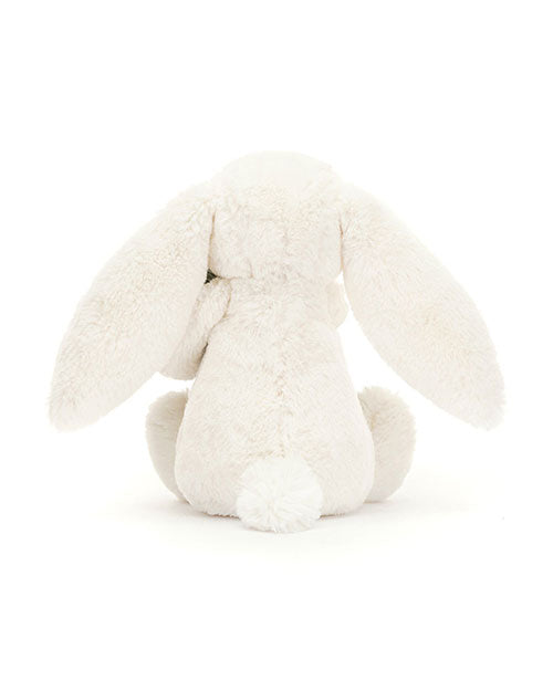 Back view of a white plush bunny toy with long floppy ears and a small round tail, featuring a soft and fluffy texture.