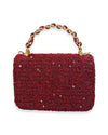 Back view of a small rectangular burgundy tweed handbag embellished with sequins, featuring a braided top handle with gold-tone chain links.