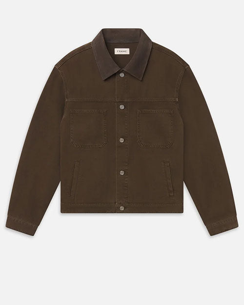 A brown denim-style jacket with a pointed collar, white metal snap-button closure, and two large chest patch pockets.