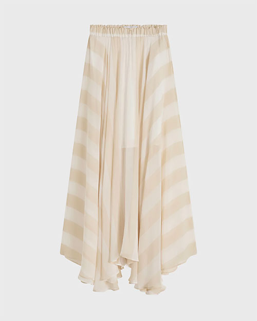 Cream flowing midi skirt with an elastic waistband, soft drape, and subtle sheer paneling, featuring an asymmetrical hem and tonal diagonal stripe pattern, shown against a light background.