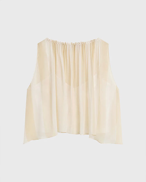 Cream sleeveless top with a gathered neckline and soft, layered flowy fabric, shown against a light background.