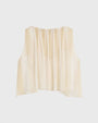 Cream sleeveless top with a gathered neckline and soft, layered flowy fabric, shown against a light background.