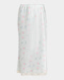 Light green floral midi skirt with a straight silhouette and lace-trimmed hem.
