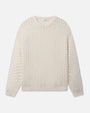 Cream-colored long-sleeve sweater with a textured bubble-knit pattern, featuring a round neckline and ribbed cuffs and hem. The design has a soft, cozy appearance.