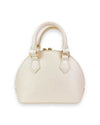 Back view of a small ivory dome-shaped handbag with dual top handles, gold-tone hardware, and a smooth, plain design without embellishments.