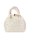 Small ivory dome-shaped handbag with dual top handles, gold-tone hardware, and decorative pearl studs arranged across the front.
